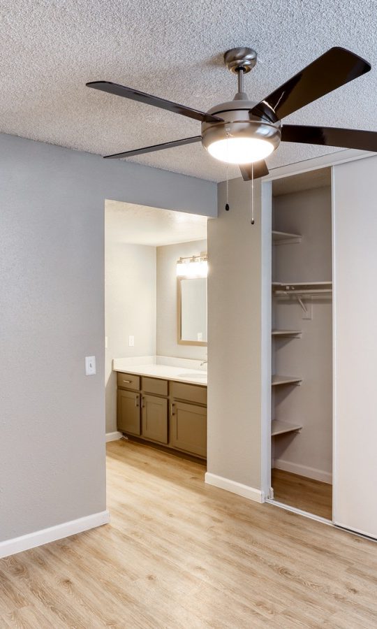 empty room with ceiling fan and closet at The Jerome