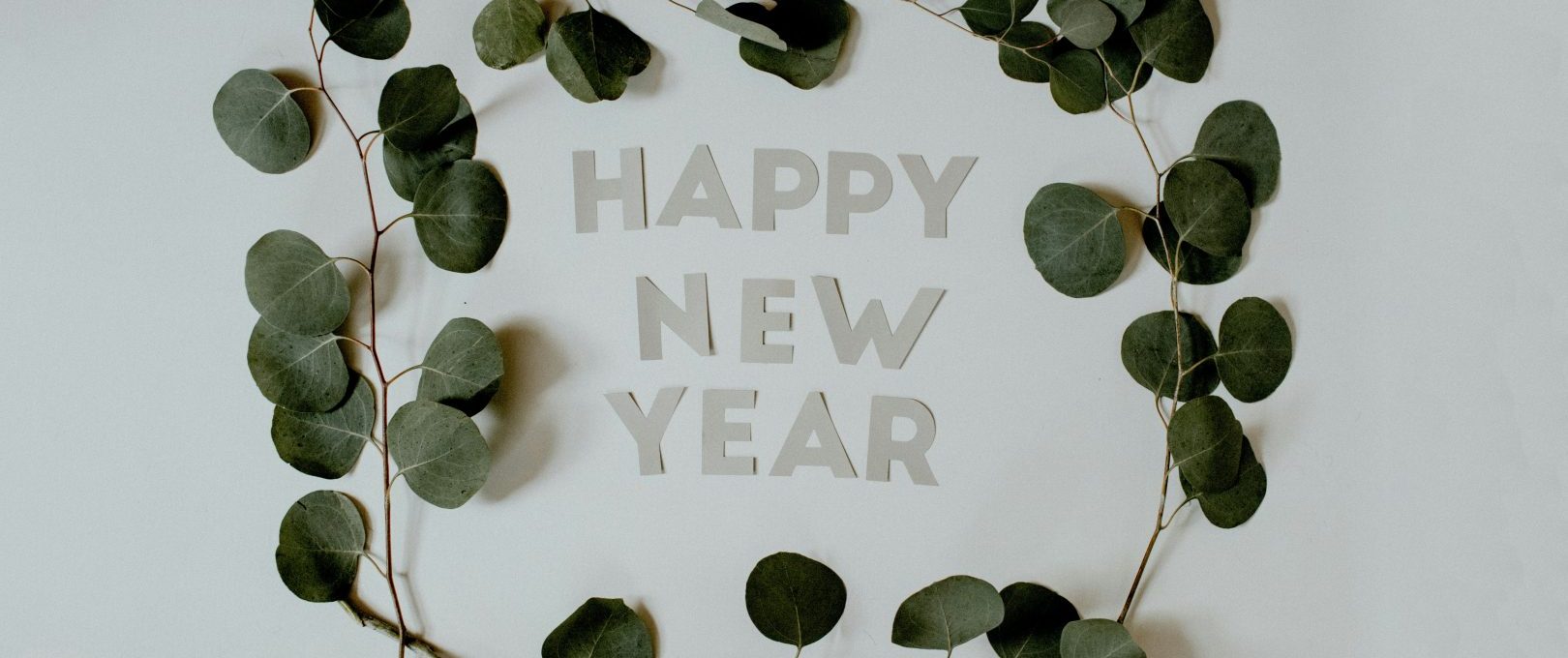 happy new year greeting card with eucalyptus leaves at The Jerome